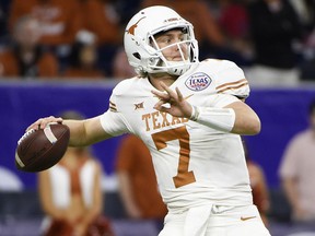 Texas quarterback Shane Buechele gets ready to throw a pass during the first half of the Texas Bowl NCAA college football game against Missouri, Wednesday, Dec. 27, 2017, in Houston.