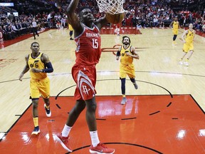 Houston Rockets center Clint Capela (15) dunks during the second half of an NBA basketball game, Monday, Dec. 18, 2017, in Houston. Houston won the game 120-99.
