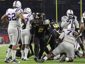 FILE - In this Dec. 2, 2017, file photo, Grambling State linebacker De'Arius Christmas (5) reacts after a fourth-down stop in the third quarter during the Southwestern Athletic Conference championship football game against Alcorn State, in Houston. Grambling plays against North Carolina A&T in the Celebration Bowl on Saturday, Dec. 16. Grambling is trying to win its second straight Celebration Bowl and finish off its season undefeated against FCS competition.