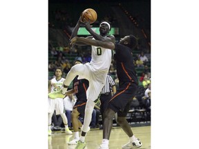 Baylor forward Jo Lual-Acuil Jr. (0) drives against Sam Houston State forward Chidozie Ndu during the first half of an NCAA college basketball game in Waco, Texas, Monday, Dec. 4, 2017.