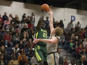 Baylor forward Nuni Omot (21) shoots over Randall guard Brad Ficken in the first half of an NCAA college basketball game in Fort Hood, Texas, Saturday, Dec. 9, 2017.