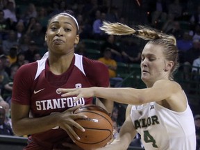 Baylor guard Kristy Wallace, right, reaches in on Stanford guard Dijonai Carrington, left, in the first half of an NCAA college basketball game, Sunday, Dec. 3, 2017, in Waco, Texas.
