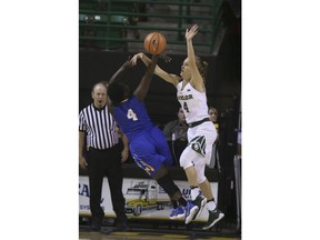 Baylor guard Kristy Wallace, right, reaches in on a shot by McNeese State guard Dede Sheppard, left, in the first half of an NCAA college basketball game, Wednesday, Dec. 13, 2017, in Waco, Texas.