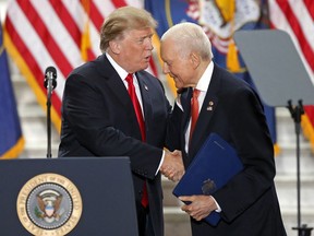 President Donald Trump shakes Sen. Orrin Hatch, R-Utah, hand at the Utah State Capitol Monday, Dec. 4, 2017, in Salt Lake City. Trump traveled to Salt Lake City to announce plans to shrink two sprawling national monuments in Utah in a move that will delight the state's GOP politicians and many rural residents who see the lands as prime examples of federal overreach, but will enrage tribes and environmentalist groups who vow to immediately sue to preserve the monuments.