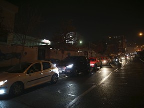 Vehicles queue outside a gas station in Tehran, on Thursday, Dec. 21, 2017, after a magnitude 5.2 earthquake jolted a town near Iran's capital late Wednesday night.