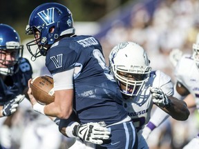 FILE - In this Oct. 14, 2017, file photo, James Madison defensive lineman Andrew Ankrah (93) latches onto Villanova quarterback Jack Schetelich (9) during the first half of an NCAA college football game in Harrisonburg, Va. Ankrah was selected for the The Associated Press FCS All-America first team on Tuesday, Dec. 12, 2017.