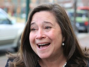 Democrat Shelly Simonds reacts to the news that she won the 94th District precincts by one vote after previously trailing incumbent David Yancey by ten votes post-election, following a recount Tuesday, Dec. 19, 2017, in Hampton, Va.