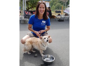 Rascal the dog is shown with a BCSPCA volunteer in a handout photo. The owner of a dog who nearly died from a massive flea infestation earlier this year, has been charged with one count of animal cruelty under the Prevention of Cruelty to Animals Act. THE CANADIAN PRESS/HO-BCSPCA MANDATORY CREDIT