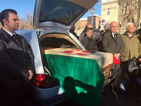 The coffin with the remains of Italy's King Victor Emmanuel III, draped in a flag with the House of Savoy crest, arrives at the Sanctuary of Vicoforte, in Vicoforte, Italy, Sunday, Dec. 17, 2017. The remains were repatriated from Egypt and interred in a family mausoleum Sunday, 71 years after Italians rejected the monarchy in a referendum and the country's royals went into exile.
