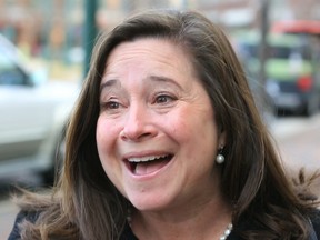 Democrat Shelly Simonds reacts to the news that she won the 94th District precincts by one vote after previously trailing incumbent David Yancey by ten votes post-election, following a recount Tuesday, Dec. 19, 2017, in Hampton, Va.