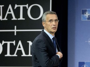 FILE - In this Nov. 7, 2017 file photo, NATO Secretary General Jens Stoltenberg arrives for a media conference at NATO headquarters in Brussels. NATO is giving Stoltenberg two more years at the head of the world's biggest military alliance, according to a NATO's statement, Tuesday, Dec. 12, 2017.