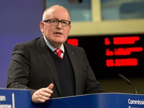 European Commission Vice-President Frans Timmermans speaks during a media conference at EU headquarters in Brussels on Wednesday, Dec. 20, 2017. The European Union's executive has triggered proceedings against Poland that could lead to sanctions over its recent decisions involving the judiciary.