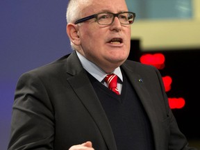 European Commission Vice-President Frans Timmermans speaks during a media conference at EU headquarters in Brussels on Wednesday, Dec. 20, 2017. The European Union's executive has triggered proceedings against Poland that could lead to sanctions over its recent decisions involving the judiciary.