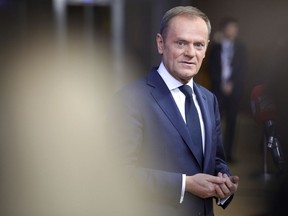 European Council President Donald Tusk speaks with journalists as he arrives for an EU summit at the Europa building in Brussels on Thursday, Dec. 14, 2017. European Union leaders are gathering in Brussels and are set to move Brexit talks into a new phase as pressure mounts on Prime Minister Theresa May over her plans to take Britain out of the 28-nation bloc.