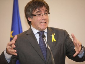 Ousted Catalan leader Carles Puigdemont speaks during a media conference in Brussels on Wednesday, Dec. 6, 2017. Catalan secessionist leader Carles Puigdemont and four close allies addressed the decision by Spain to drop a European arrest warrant against them and assessed the Dec. 21 elections in the Spanish region which will help determine the drive for independence.