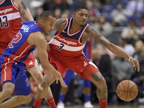 Detroit Pistons guard Avery Bradley (22) works for the ball against Washington Wizards guard Bradley Beal (3) during the first half of an NBA basketball game, Friday, Dec. 1, 2017, in Washington.