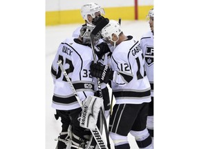 Los Angeles Kings right wing Marian Gaborik (12), of Slovakia, celebrates with goalie Jonathan Quick (32) after an NHL hockey game against the Washington Capitals, Thursday, Nov. 30, 2017, in Washington. The Kings won 5-2. (AP Photo/Nick Wass)