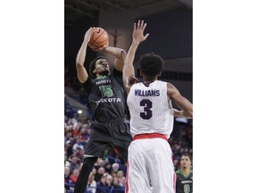 North Dakota guard Cortez Seales (15) shoots against Gonzaga forward Johnathan Williams (3) during the first half of an NCAA college basketball game in Spokane, Wash., Saturday, Dec. 16, 2017.