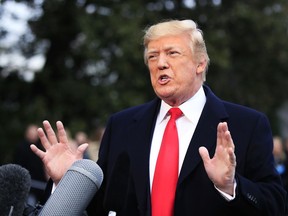 President Donald Trump speaks to reporters before leaving the White House in Washington, Friday, Dec. 15, 2017, for a trip to Quantico, Va., to attend the FBI National Academy graduation ceremony.