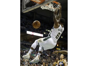 Milwaukee Bucks' Eric Bledsoe dunks during the first half of an NBA basketball game against the Utah Jazz, Saturday, Dec. 9, 2017, in Milwaukee.