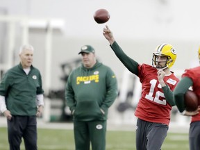 Green Bay Packers quarterback Aaron Rodgers (12) throws during practice at the Don Hutson Center on Wednesday, Dec. 13, 2017 in Ashwaubenon, Wis.