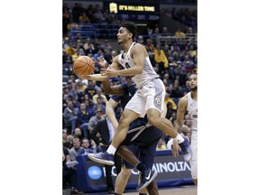 Marquette guard Markus Howard drives to the basket against Xavier during the first half of an NCAA basketball game, Wednesday, Dec. 27, 2017, in Milwaukee.
