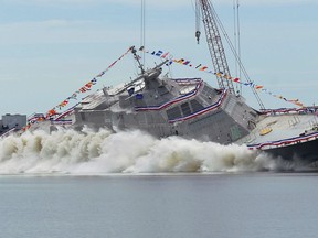 FILE - In this July 18, 2015, file photo, the USS Little Rock littoral combat ship is launched into the Menominee River at Marinette, Wis. The USS Little Rock is expected to arrive at Buffalo's Lake Erie waterfront on Monday, Dec. 4, 2017. It will be commissioned Dec. 16 at the Buffalo and Erie County Naval and Military Park, where three World War II vessels are docked.