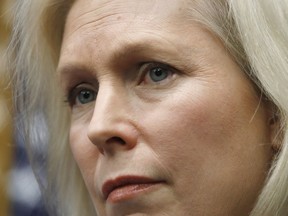 In this Dec. 6, 2017 photo, Sen. Kirsten Gillibrand, D-N.Y., listens during a news conference on sexual harassment on Capitol Hill in Washington. President Donald Trump laced into Democratic Sen. Kirsten Gillibrand on Tuesday, tweeting that she would come to his office "begging" for campaign contributions and "do anything" to get them.