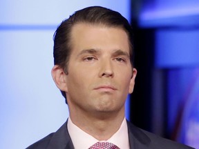 FILE - In this July 11, 2017, file photo, Donald Trump Jr. is interviewed by host Sean Hannity on his Fox News Channel television program, in New York.   Trump has arrived on Capitol Hill for a private interview as part of the House intelligence committee's investigation into Russian interference in the 2016 election.