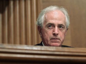 In this Dec. 5, 2017 file photo, Sen. Bob Corker, R-Tenn., listens during a meeting of the Senate Banking Committee on Capitol Hill in Washington. The Senate Finance Committee chairman on Monday rejected as "categorically false" a report that Republican Sen. Bob Corker of Tennessee was responsible for a provision in the final tax bill that could help him financially.