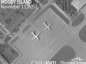 This image provided by CSIS Asia Maritime Transparency Initiative/DigitalGlobe shows a satellite image of Woody Island in the Paracel island chain in the South China Sea taken Nov. 15, 2017, and annotated by the source, showing two Chinese Y-8 military transport aircraft. The Washington-based Asia Maritime Transparency Initiative says China has undertaken new deployments of military aircraft on the island in recent weeks. On other outposts in the disputed South China Sea has conducted major construction work during 2017.(CSIS Asia Maritime Transparency Initiative/DigitalGlobe via AP)