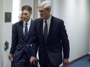 FILE - In this June 21, 2017, file photo, former FBI Director Robert Mueller, the special counsel probing Russian interference in the 2016 election, departs Capitol Hill following a closed door meeting in Washington. Mueller has produced hundreds of thousands of documents, copies of data from 36 electronic devices and gathered 2,000 "hot" documents in the government's case against Paul Manafort and Rick Gates. Mueller's investigators made copies of information on cell phones and hard drives and disclosed the existence of 15 search warrants and other requests in their investigation of Trump's former campaign chairman and his deputy, according to a new court filing made Friday.