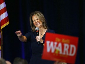 FILE - In this Oct. 17, 2017, file photo, former Republican Arizona state Sen. Kelli Ward smiles as she is greeted by supporters at a campaign fundraiser, in Scottsdale, Ariz. Some Republican Party leaders warn that conservative candidates with problematic track records like Danny Tarkanian In Nevada or Arizona state Sen. Kelli Ward can't win general election battles and will lead the GOP to lose seats in 2018.