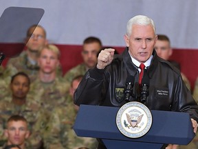 U.S. Vice President Mike Pence speaks to troops in a hangar at Bagram Air Base in Afghanistan on Thursday, Dec. 21, 2017. Mandel Ngan/Pool via AP)