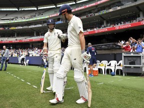 England's Alastair Cook, right, and James Anderson prepare to run out against Australia at the start of the fourth day of their Ashes cricket test match in Melbourne, Australia, Friday, Dec. 29, 2017.