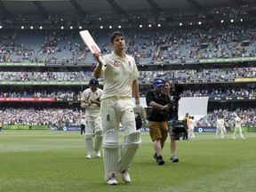England's Alastair Cook walks off the ground not out at stumps on the third day of their Ashes cricket test match against Australia in Melbourne, Australia, Thursday, Dec. 28, 2017.