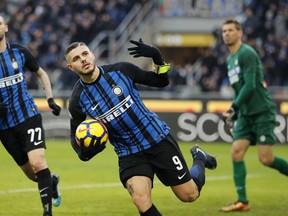 Inter Milan's Mauro Icardi scores his side's opening goal during the Serie A soccer match between Inter Milan and Udinese at the San Siro stadium in Milan, Italy, Saturday, Dec. 16, 2017.