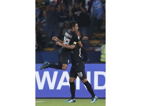 Pachuca's Roberto De La Rosa, right, celebrates with Erick Sanchez after scoring his side's third goal during the Club World Cup third place soccer match between Al Jazira and CF Pachuca at Zayed Sports City stadium in Abu Dhabi, United Arab Emirates, Saturday, Dec. 16, 2017.