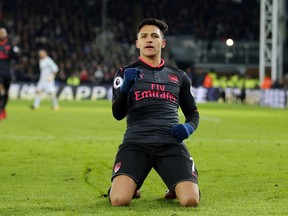 Arsenal's Alexis Sanchez celebrates after scoring his side's second goal of the game during their English Premier League soccer match between Crystal Palace and Arsenal at Selhurst Park stadium in London, Thursday, Dec. 28, 2017.