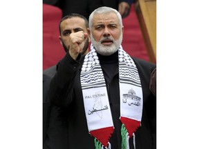 Head of the Hamas political bureau, Ismail Haniyeh, chants slogans during protest against U.S. President Donald Trump's decision to recognize Jerusalem as Israel's capital, in Gaza City, Friday, Dec. 29, 2017. Arabic reads "Palestine, Jerusalem for us".