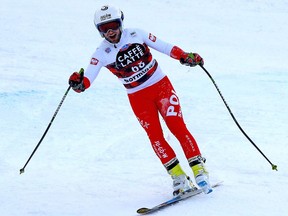 Polish skier Pawel Babicki arrives at finish line, completing the race after loosing one of his skis during the feared Stelvio downhill, in Bormio, Italy, Thursday, Dec. 28, 2018. Babicki decided to continue skiing all the way to the finish _ just like Miller did during the downhill portion of the combined at the 2005 world championships on the same course in Bormio.