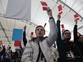 Supporters of Russian opposition leader Alexei Navalny vote during a meeting that their candidate for the presidential election race is nominated in Moscow, Russia, Sunday, Dec. 24, 2017. Opposition leader Navalny is barred from the race by an embezzlement conviction he calls politically motivated. Nevertheless, the 41-year-old anti-corruption crusader has run a yearlong grass-roots campaign and staged waves of rallies to push the Kremlin to let him run.