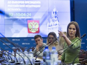 Russian celebrity TV host Ksenia Sobchak, who wants to challenge Russian President Vladimir Putin in the March 18 presidential election, gestures while speaking after submitting endorsement papers in support of his presidential bid to a member of Russia's Central Election commission in Moscow, Russia, Monday, Dec. 25, 2017.