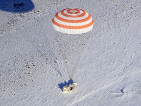 The Russian Soyuz MS-05 space capsule lands about 150 km (90 miles) south-east of the Kazakh town of Zhezkazgan, Kazakhstan, Thursday, Dec. 14, 2017. Three astronauts on Thursday landed back on Earth after nearly six months aboard the International Space Station.