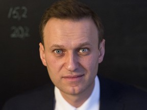 Russian opposition politician Alexei Navalny poses for a photo prior his interview to the Associated Press in Moscow, Russia, Monday, Dec. 18, 2017. Russian opposition leader Alexei Navalny says he's confident he could beat Russian President Vladimir Putin in a fair election.