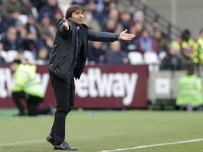 Chelsea's manager Antonio Conte reacts during the English Premier League soccer match between West Ham United and Chelsea at the London stadium in London, Saturday, Dec. 9, 2017.