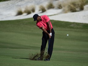 Tiger Woods hits from the first fairway during the final round of the Hero World Challenge golf tournament at Albany Golf Club in Nassau, Bahamas, Sunday, Dec. 3, 2017.