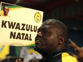 Delegates wait for the delayed start of the ruling African National Congress (ANC) elective conference in Johannesburg, Saturday, Dec. 16 2017. The fight to replace South Africa's scandal-prone President Jacob Zuma began Saturday as thousands of delegates of the ruling African National Congress gathered to elect a new leader.