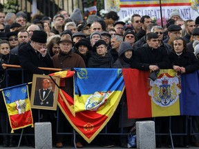 People wait outside the former royal palace to attend Romanian King Michael's funeral ceremony in Bucharest, Romania, Saturday, Dec.16, 2017. Thousands waited in line to pay their respects to Former King Michael, who ruled Romania during WWII, and died on Dec. 5, 2017, aged 96, in Switzerland.