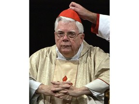 FILE - In this Thursday, Aug. 5, 2004 file photo, Cardinal Bernard Law has his skull cap adjusted during the ceremony for Our Lady of the Snows, in St. Mary Major's Basilica in Rome, Italy. An official with the Catholic Church said Tuesday, Dec. 19, 2017, that Cardinal Bernard Law, the disgraced former archbishop of Boston, has died at 86. Law recently had been hospitalized in Rome. Law stepped down under pressure in 2002 over his handling of clergy sex abuse cases.